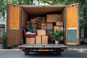 A moving truck filled with boxes and furniture, ready for transport. photo