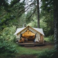 A cozy glamping tent nestled in a lush forest, perfect for relaxation and nature immersion photo