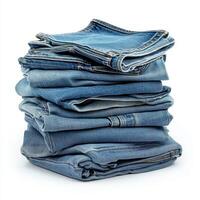 A neatly stacked pile of folded blue jeans showcasing casual clothing. photo