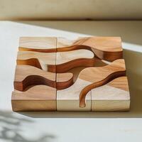 A set of wooden puzzle pieces with flowing shapes, designed for tactile play and creativity. photo