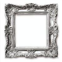A decorative, ornate silver picture frame with intricate designs and no image inside. photo