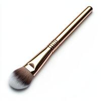 A makeup brush with a sleek rose gold handle and soft bristles for applying cosmetics. photo