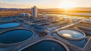 Aerial view of a water treatment facility with large tanks and industrial structures. photo