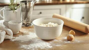 A kitchen scene with flour, dough, and baking tools, ready for food preparation. photo