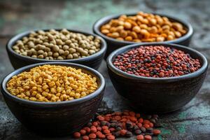 A collection of colorful spices and seeds in bowls, showcasing culinary variety and texture photo