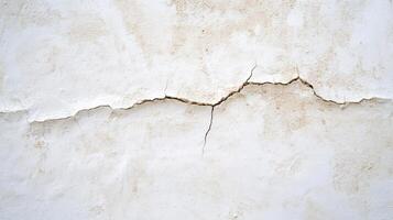 A close-up of a cracked white wall, highlighting texture and damage. photo