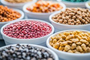 A variety of colorful grains and legumes displayed in bowls for culinary use photo