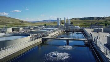 Aerial view of a water treatment facility with tanks and processing equipment photo