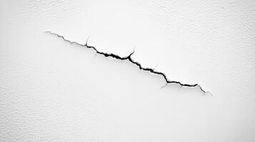 A crack in a white wall, highlighting structural damage or wear photo