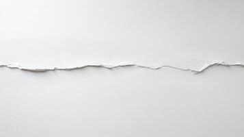 A torn piece of white paper creating an abstract line against a plain background photo