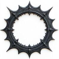 A decorative, spiked black circular frame with intricate designs photo
