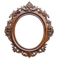Ornate wooden picture frame with intricate carvings and an empty oval center. photo