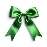 A shiny green satin bow with long tails, often used for gift wrapping and decorations photo
