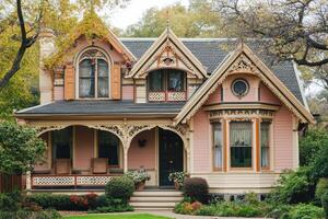 A charming Victorian-style house with ornate details and a welcoming porch. photo