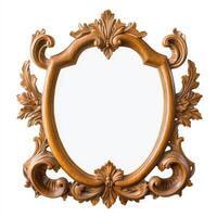 Ornate wooden mirror frame with intricate carvings and a blank reflective surface. photo