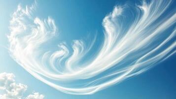 A captivating sky displaying wispy clouds against a blue backdrop. photo