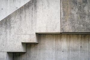 Abstract concrete staircase detail with textured surfaces and geometric lines. photo