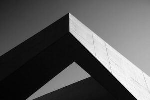 Abstract architectural structure showcasing geometric shapes in monochrome. photo