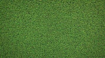 A close-up view of vibrant green artificial grass photo
