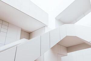 A modern architectural design featuring intersecting white staircases and clean lines. photo