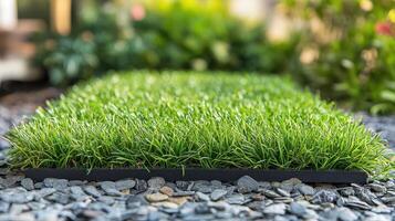 Artificial grass mat on gravel, showcasing a vibrant green surface for landscaping purposes photo