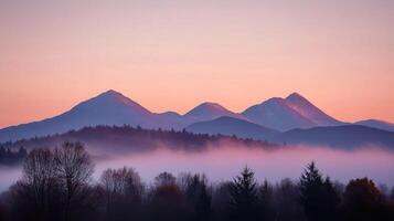 Serene mountain landscape at dawn with mist and soft pastel colors photo