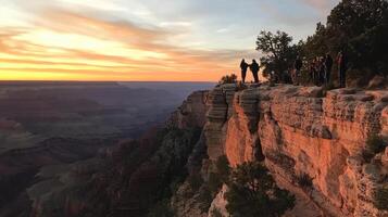 Sunset view at the Grand Canyon with visitors enjoying the scenery. photo