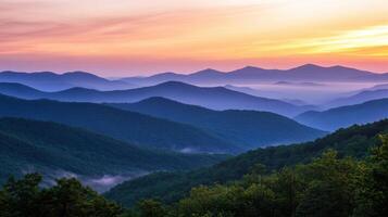 Serene mountain landscape at sunrise with layers of hills and mist. photo