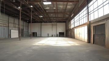 A spacious industrial warehouse with high ceilings and large windows. photo