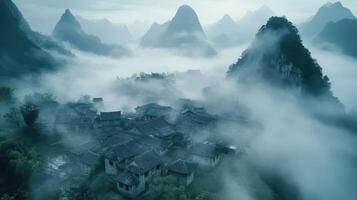 A misty village nestled among mountains, evoking a serene and mysterious atmosphere photo