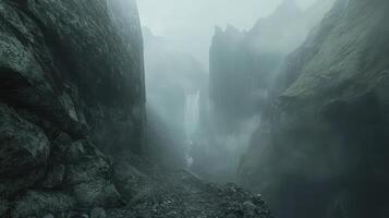 A misty landscape featuring a waterfall surrounded by towering cliffs and fog photo