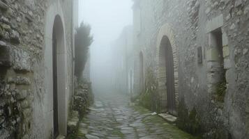 A foggy alleyway in a stone village, creating a mysterious and tranquil atmosphere. photo