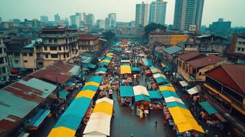 A bustling market scene with colorful tents and tall buildings in the background. photo