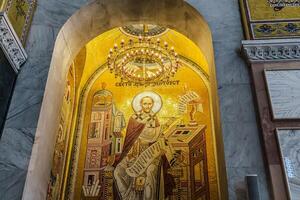 A large mosaic of a man in a church photo