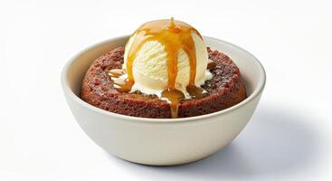 Toffee Pudding Served Warm in a Classic Bowl Topped with a Scoop of Melting Vanilla Ice Cream Alternative photo