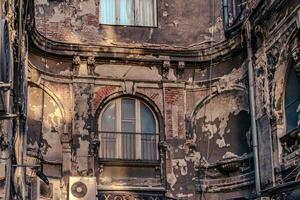 An old building with a lot of windows and a clock photo
