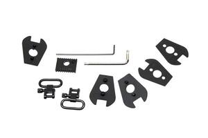 A set of black plastic spacers, swivels, and wrenches for firearm assembly and disassembly, isolated on a white background. photo