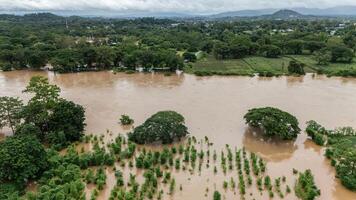 Aerial view of Mae Kok river rising and flooding rural area in Chiang Rai province of Thailand. photo
