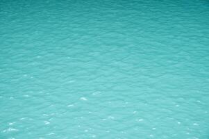 Turquoise water from limestone waterfall. photo