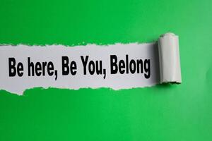 The Be here, Be You, Belong Text written in torn paper photo