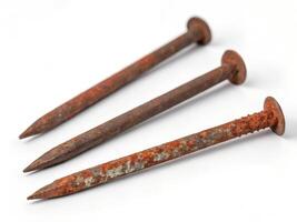 Set of Three Rusty Nails Floating isolated on White Background photo