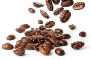 Coffee beans falling on a white background. photo