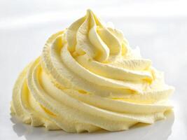 A close up of a white waffle cone with whipped cream photo