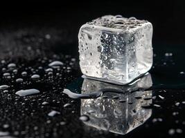 Melting ice cube on reflective surface isolated photo
