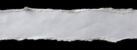 Torn Paper Edge in Center isolated on Black background photo