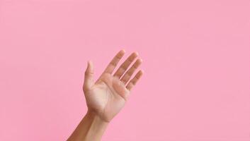Open Hand Against a Pink Background photo