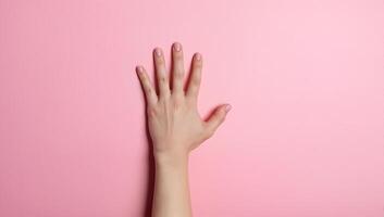 Elegant Hand on Pink Background photo