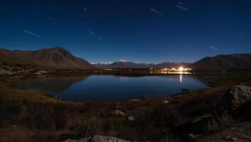 Starry Night Over Mountain Lake with Reflections photo