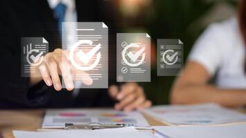 Accountant showing office document auditing concept , Management of important document storage of organization , plan review process and assess correctness , document system photo