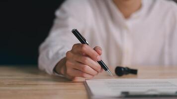 Business Agreements and Approvals , business contract signing , guarantee correctness , Signing a form , Business paperwork, Confirmation of contract documents or warranty card , legal contract photo